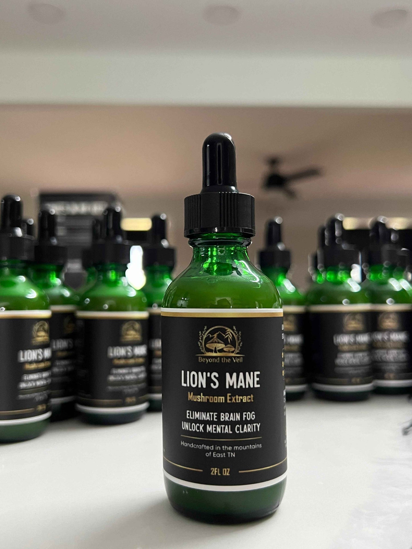 Bottle of Lion's Mane supplement with dropper on a white surface