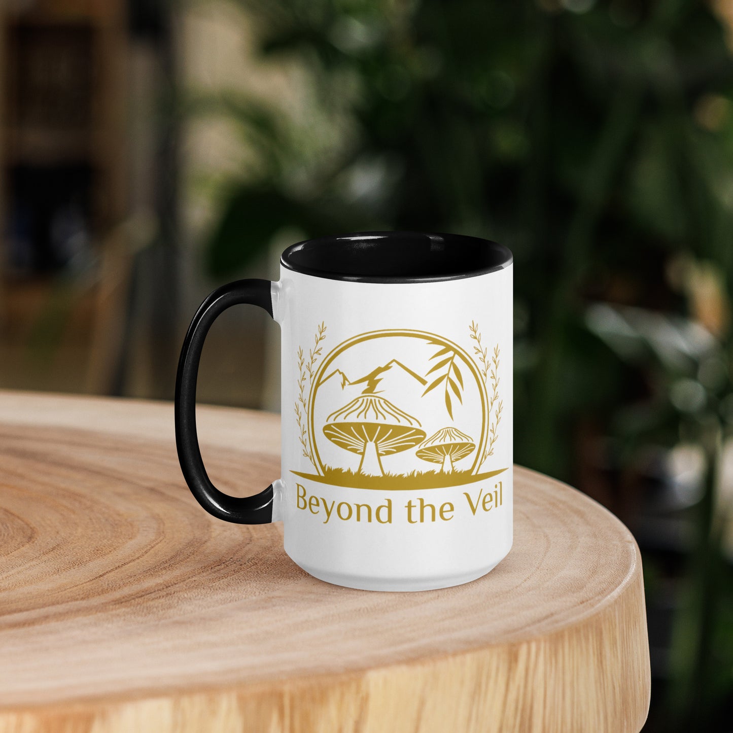 White mug with black interior and handle, featuring a gold logo and text 'Beyond the Veil' on a forest background